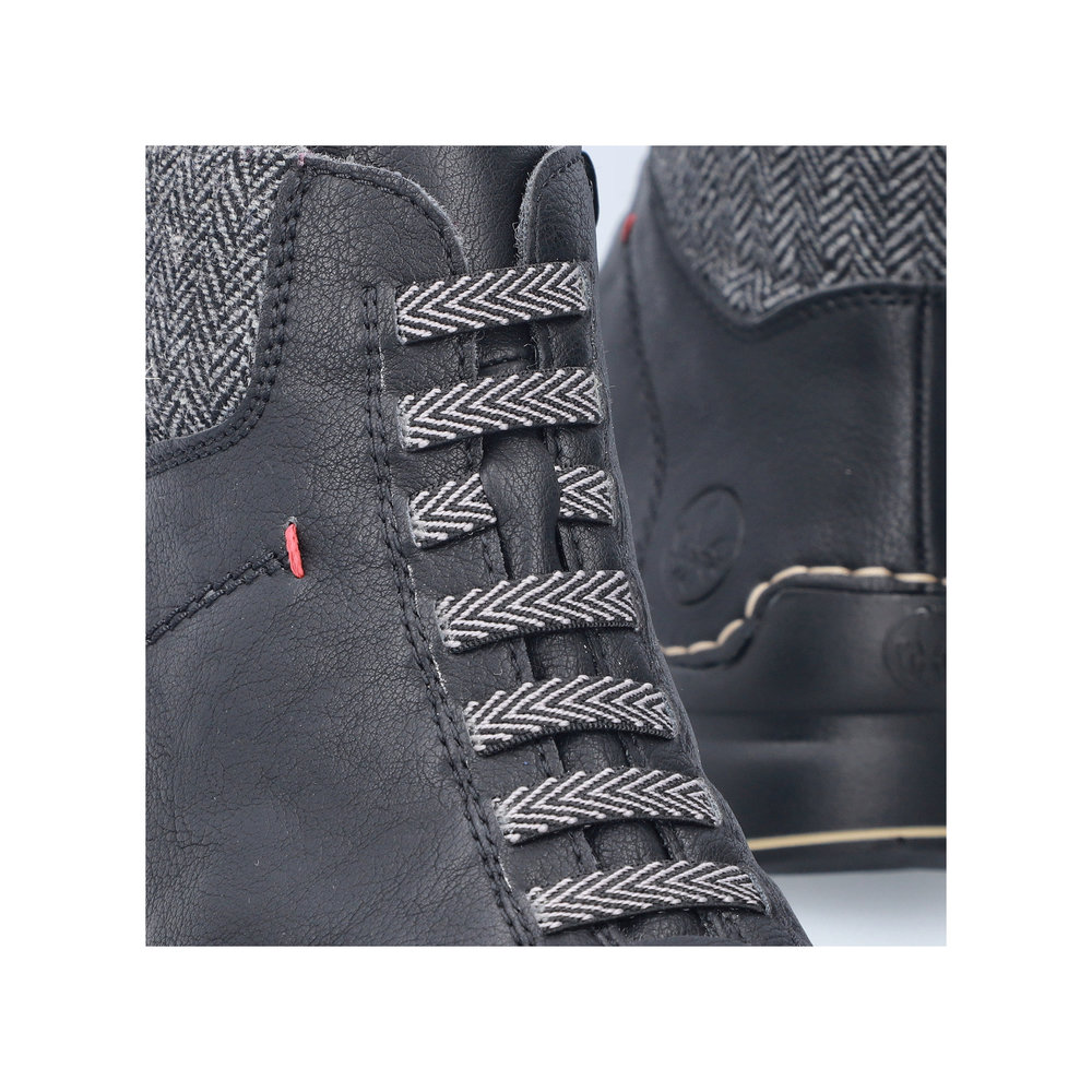 detail Dámská kotníková obuv Rieker 51553-00 černá